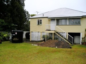 Soil excavated for sewage system spread on site...