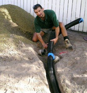 Brisbane landscapers ‘Green Survival’ did all the hard work, here laying ag pipe.